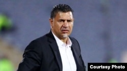 Ali Daei, a former star in Germany's Bundesliga soccer league, had his passport revoked over his call last month for the government to "solve the problems of the Iranian people rather than using repression, violence and arrests." (file photo)