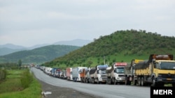 Iranian trucks are parked on the main road connecting Armenia with Iran.