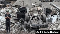 A Ukrainian police expert works at the site of a Russian missile strike in Kryviy Rih on August 28.