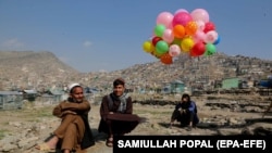 A vendor sells colorful balloons on the Nowruz day in Kabul, March 21, 2023.