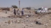 Pakistani security officials examine the site of a deadly bomb attack targeting a procession in Balochistan on September 29. 