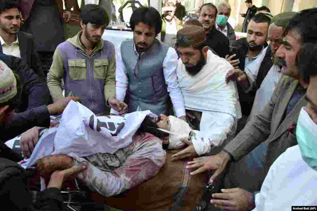 Workers and volunteers transport a victim of the bombing to a hospital in Quetta. Pakistanis go to the polls on February 8 amid rising militant attacks and the jailing of former Prime Minister Imran Khan, the winner of the last national election, who has been dominating the headlines.