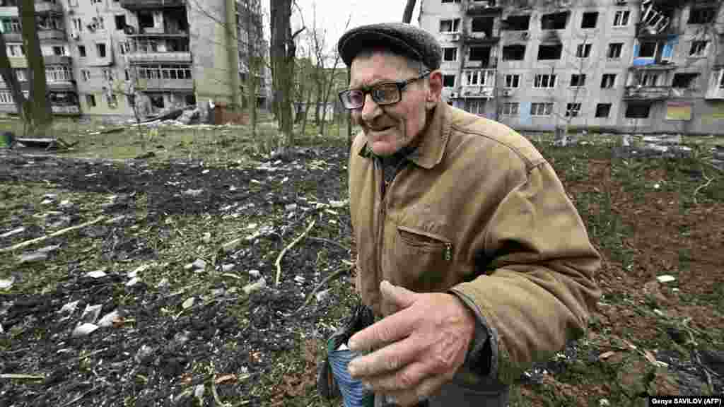 Grozdov is one of the residents who chose to remain in the burnt-out shell of the former town. AFP journalists first met him on April 4 (pictured) after they found him lying at the bottom of a crater. With his poor eyesight, he had fallen in while gathering food that had spilled out of his bag and was unable to climb out. 