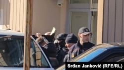 Policija provodi Binalija Čamgoza u ured tužioca, Podgorica, januar 2024.