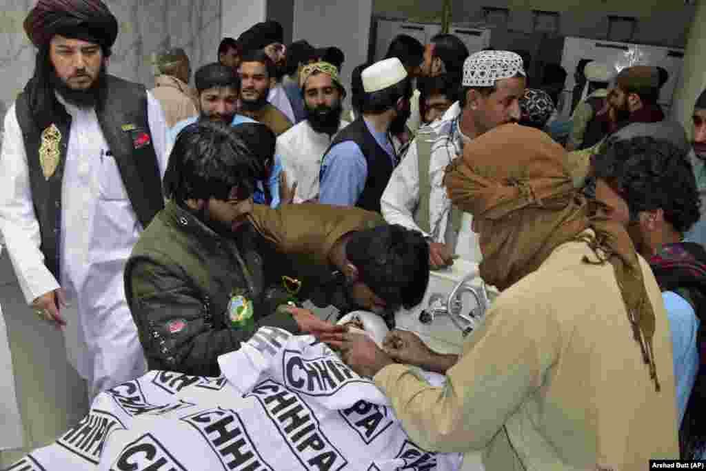 People mourn as they gather around the body of a relative who was killed in the attack during a religious celebration in Balochistan Province. Balochistan, Pakistan's largest province, borders both Afghanistan and Iran. The region is regularly targeted by Islamist militants, sectarian groups, and nationalist separatists. 