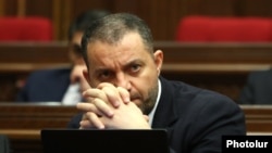 Armenia - Economy Minister Vahan Kerobian attends a session of the Armenian parliament.