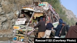 Rescuers work at the scene of the crash on February 4.