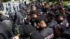 Armenia - Riot police confront Catholicos Garegin II and other top clergymen at Sardarapat memorial, May 28,. 2024.