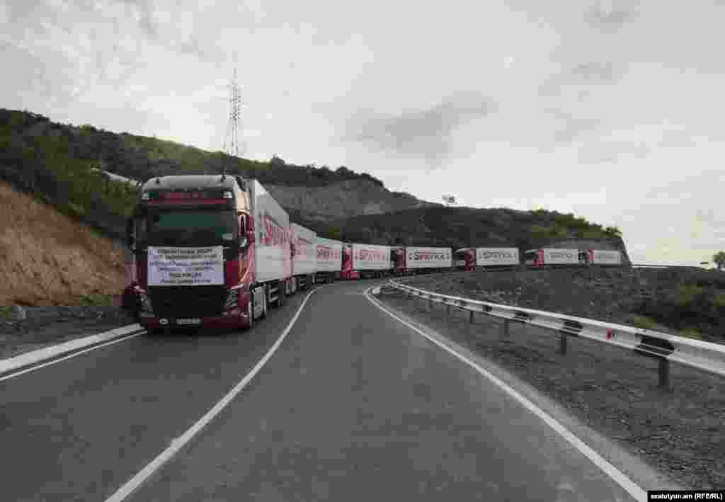 The truck convoy stopped on a road near Nagorno-Karabakh on July 26. The trucks reached an Azerbaijani checkpoint that was controversially set up in April on the Lachin Corridor, the main road connecting Armenia with Nagorno-Karabakh, but was prevented from driving through. The Azerbaijani Foreign Ministry has condemned the aid convoy as a "provocation." 