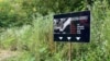 Peace March, Mass Grave sign, Bosnia, July 9, 2023. 