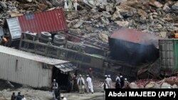 PHOTO GALLERY: Massive Landslide Buries Trucks, Kills At Least Two People In Pakistan