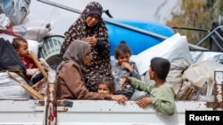 Palestinians fleeing Rafah earlier this month