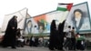 Iranka u Teheranu nosi palestinsku zastavu tokom skupa podrške Palestincima 13. oktobra 2023. 