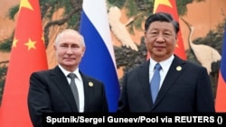 Орусиянын президенти Владимир Путин менен Кытайдын лидери Си Цзинпинь.
