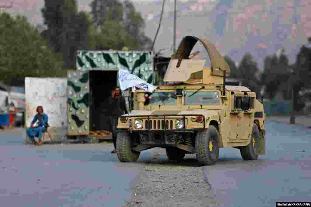 A Humvee is seen near the closed gates of the Torkham border crossing. Pakistan defended its decision to close its main border crossing with landlocked Afghanistan, saying Taliban authorities there were trying to build "unlawful structures" on its territory and "resorted to indiscriminate firing" when challenged. 