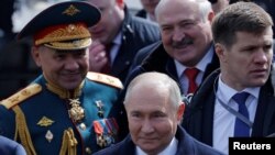 Шойгу, Лукашенко і Путін на параді на Красній площі в Москві. 9 травня 2024 року 