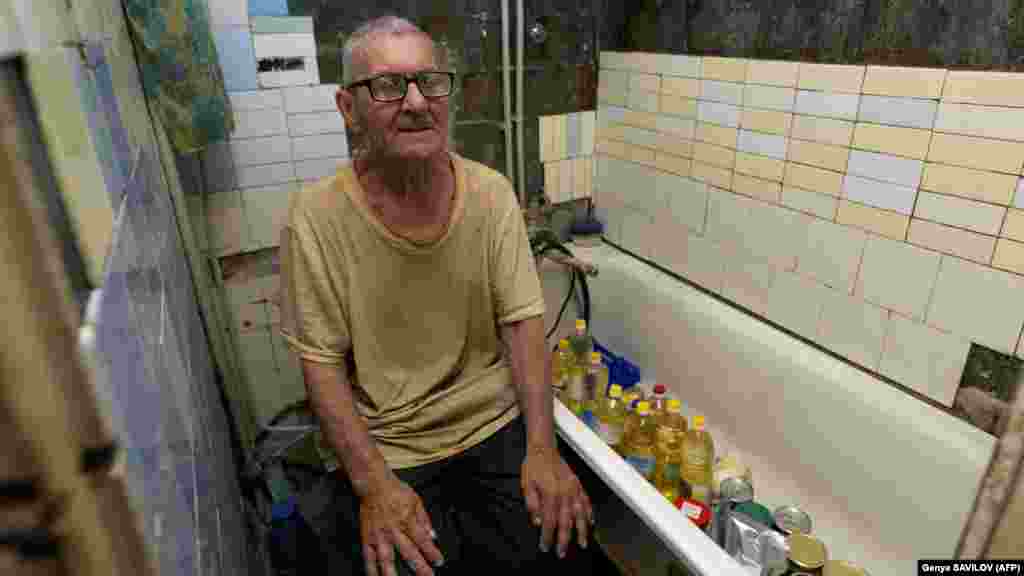 Viktor Grozdov, 77, sits in the bathroom of his damaged home on June 28 in the eastern Ukrainian town of Avdiyivka. The bathroom has become his refuge when the artillery shells rain down. A suburb of the city of Donetsk, Avdiyivka is shelled up to 30 times a day. "In the last four months or so, there hasn't been a day without aerial or rocket strikes," the head of the military administration, Vitaliy Barabash, told AFP.