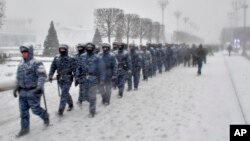 Russian National Guard soldiers walk in Moscow on December 4.