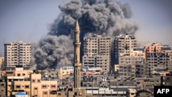 Smoke plumes billow during Israeli air strikes in Gaza City on October 12. Nico Lange says that 'new elements of warfare' from Ukraine are now being seen in the Israel-Hamas conflict.