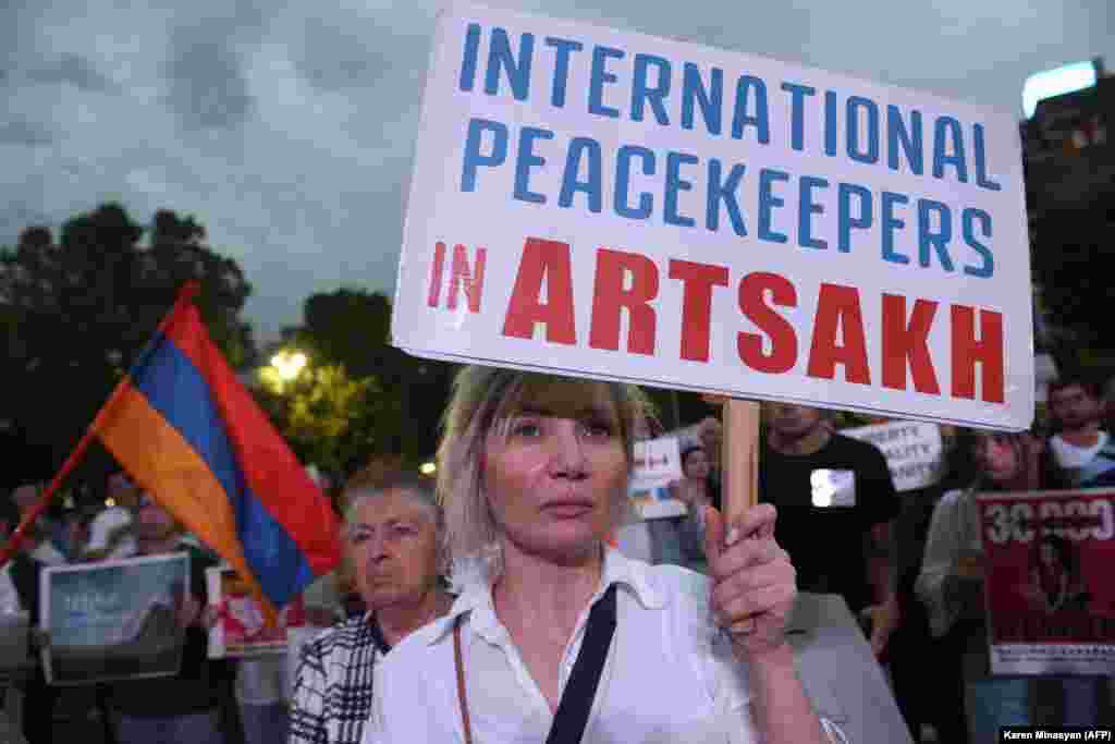 A woman calling for intervention in Nagorno-Karabakh, which Armenians refer to as Artsakh. 