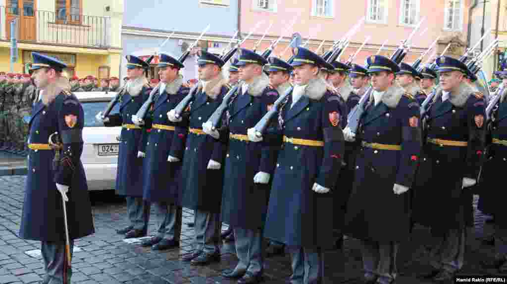Palace guards prepare to meet the procession as the hearse carrying the former president Vaclav Havel arrives at Prague Castle.