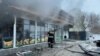 Emergency personnel extinguish the fire in Ufa on February 9.