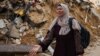 O femeie reacționează în urma loviturilor israeliene asupra Rafah, în sudul Fâșiei Gaza. 24 octombrie 2023. (AFP)