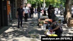 Vegetables and fruits on sale in the middle of a sidewalk in central Yerevan (file photo).