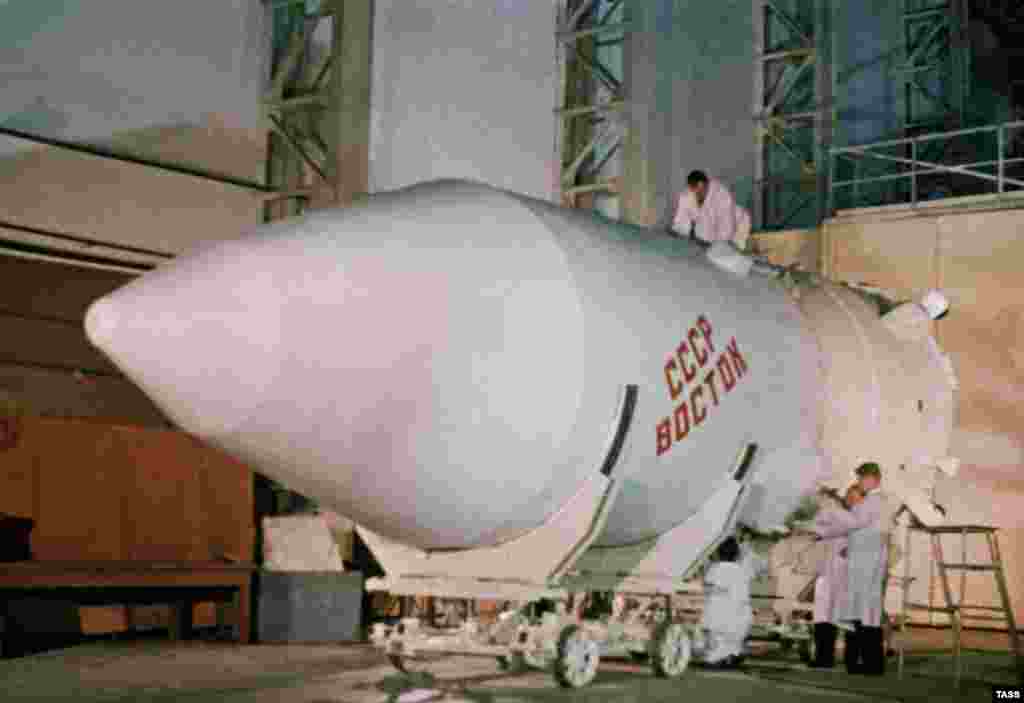 Final checks are made to the Vostok (East) rocket that would launch Soviet cosmonaut Yuri Gagarin into orbit in 1961. Multiple historic launches were made from Baikonur, including the first satellite (October 1957), the first dog (November 1957), the first man (1961), and the first woman (1963) into space. 