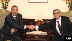 Prior to Munich, Armenian President Serzh Sarkisian (right) met with his Azerbaijani counterpart, Ilham Aliyev, in the Moldovan capital, Chisinau, on October 8.