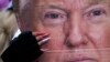  SUA - O femeie, cu un portret al președintelui Donald Trump miercuri, 6 ianuarie 2021, la Washington, la un miting în sprijinul său, cu câteva ore ca participanții la miting să ia cu asalt Capitoliul 