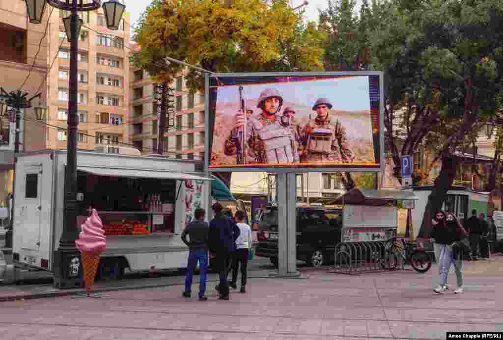 A television plays a loop of soldiers and military exercises in downtown Yerevan on October 28. 