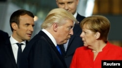 Američki predsjednik Donald Trump, francuski predsjednik Emmanuel Macron i njemačka kancelarka Angela Merkel 