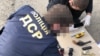 Ukrajinski policajci tokom akcije hapšenja učesnika oružanog napada, državljana Crne Gore, u Kijevu, 27. maja 2020.