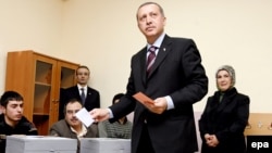 Prime Minister Recep Tayyip Erdogan casts his vote in Istanbul. The AK leader said his party had "learned [its] lesson."
