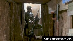 A Ukrainian soldier is seen at the line of separation from Russia-backed separatists near Donetsk on April 19.