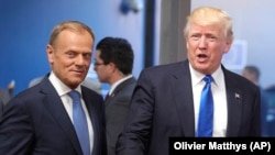 U.S. President Donald Trump (right) speaks with European Council President Donald Tusk in Brussels earlier this year.