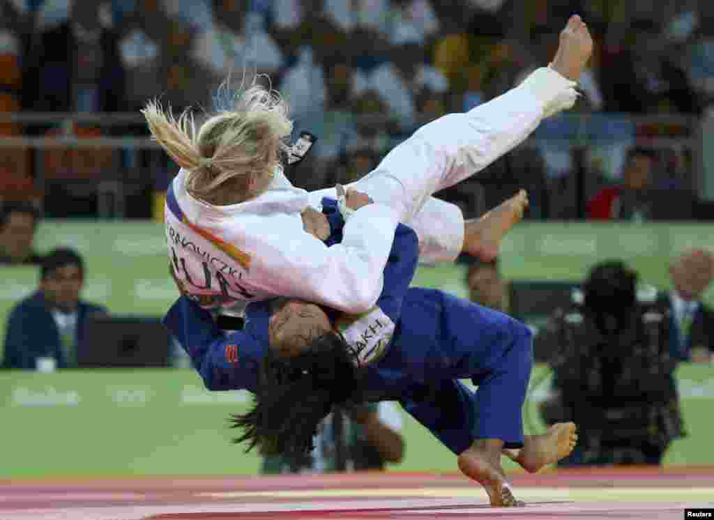 Judokas Eva Csernoviczki of Hungary (in white) and Otgontsetseg Galbadrakh of Kazakhstan compete in the women's 48-kilogram repechage contests. Galbadrakh ended up winning the bronze medal. 