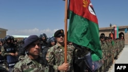 Afghan National Army soldiers stand in formation during a ceremony handing control of Bagram prison over to Afghan authorities.