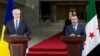 Asaad Shaybani (right), foreign minister for the interim Syrian government, and Ukrainian Foreign Minister Andriy Sybiha give a joint press conference in Damascus on December 30.