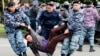 Police detain opposition supporters during a protest calling for free and fair elections during the presidential election in Nur-Sultan, Kazakhstan, in June 2019. 
