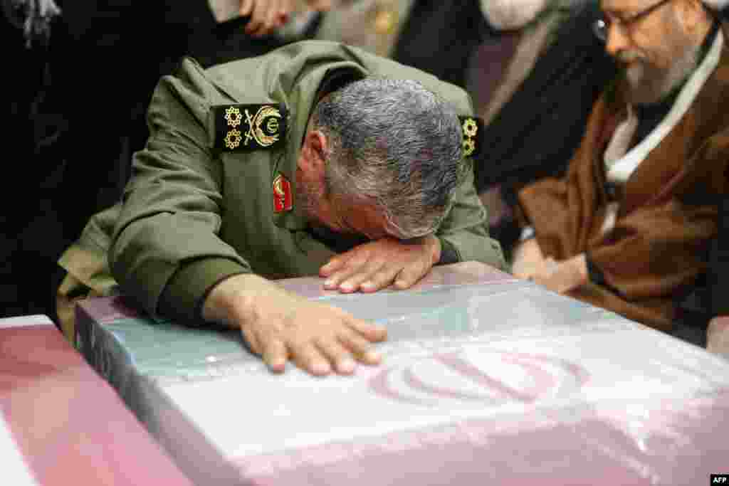 The new Quds Force leader, General&nbsp;Ismail Qaani, wept on the flag-draped coffin of his slain predecessor, Qasem Soleimani.