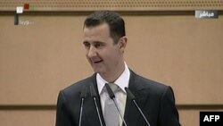 Syrian President Bashar al-Assad gives a speech in Damascus on January 10.