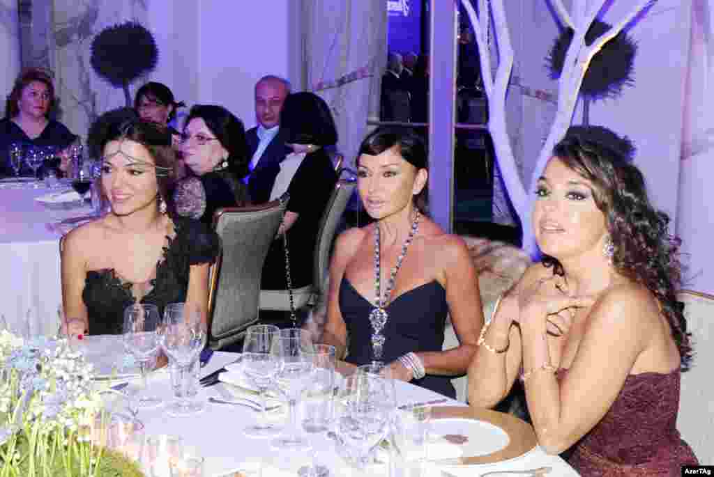 Mehriban (center) attends a presentation by "Nargis" magazine in January 2013 with her daughters, Leyla (right) and Arzu. U.S. diplomats have been cited in Wikileaks documents as expressing confusion between mother and daughters, fueling rumors that Aliyeva and her daughters may have undergone plastic surgery.