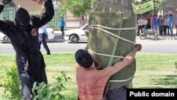 The Amnesty statement included an image used in Iranian news coverage of the incident, showing a young man tied to a tree as he was being flogged by a masked man. The rights watchdog said it could not independently verify whether it was a photo of the actual flogging in question.