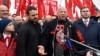 U.S.-born mixed martial arts fighter Jeff Monson (center) attends a wreath-laying ceremony to mark the 146th birthday of Soviet state founder Vladimir Lenin at his mausoleum on Red Square in Moscow in 2016. 