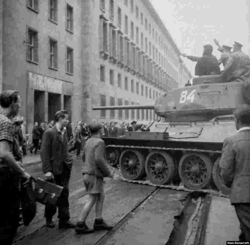 A Soviet T-34 amid a crowd of demonstrators in East Berlin during the East German uprising, June 17, 1953.