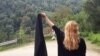 Under Islamic laws enforced in Iran since the 1979 revolution, women are required to cover their hair and body in public. Today, some women have removed their scarves while driving or otherwise in public to protest the laws. (illustrative photo)