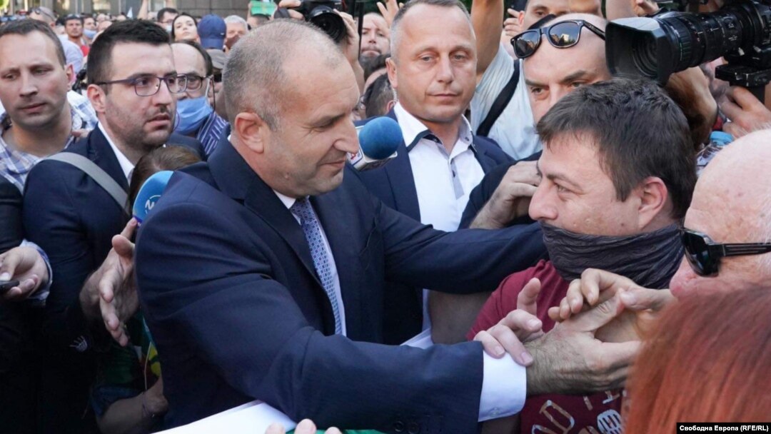 Bulgarian President Rumen Radev (left) came out and thanked protesters for their support. 