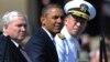 U.S. President Barack Obama (center) was flanked at a tribute in June by outgoing Defense Secretary Robert Gates (left) and Admiral Mike Mullen, both of whom concluded the repeal wouldn't harm the military.